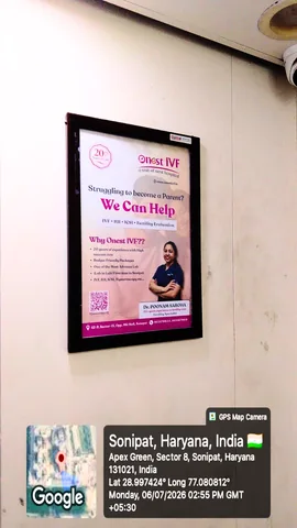 Onest IVF advertisement in a framed poster site
